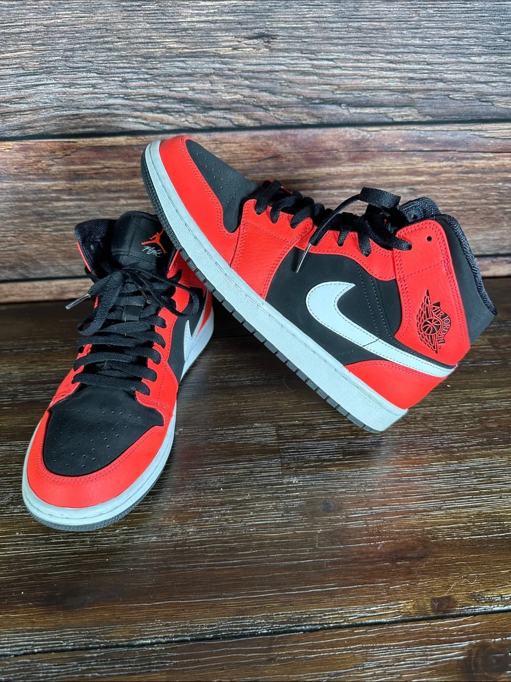 Nike Air Jordan 1 Mid Infrared 23 sneakers in Black and Neon Red